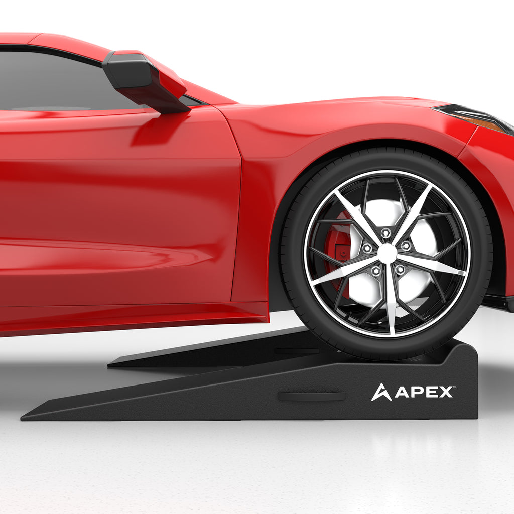 APEX 48-in. garage ramps positioned under a vehicle for stable service access.