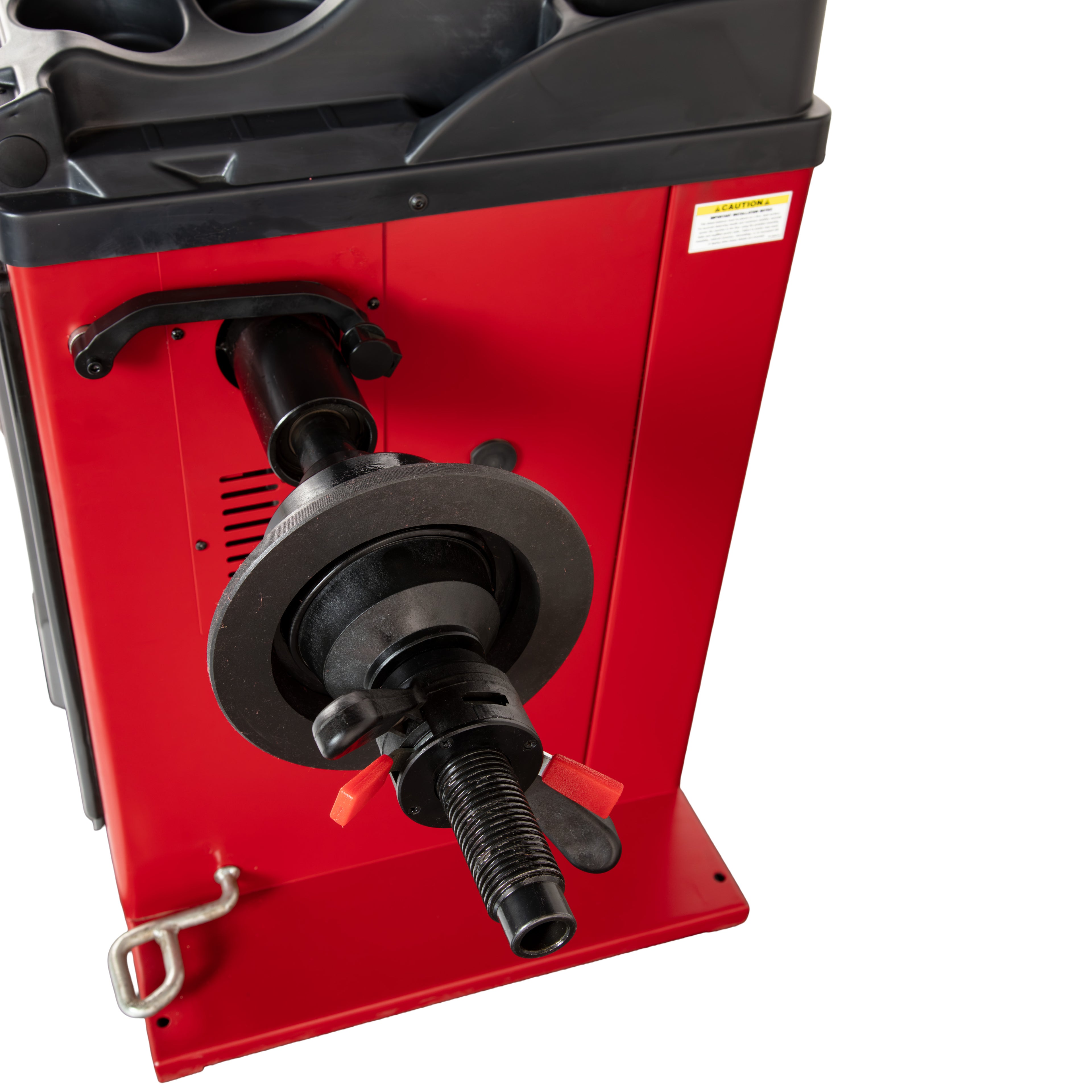 Rigid mounting shaft with centering cone and no-mar Quick-Nut securing a wheel on an APEX AB28 wheel balancer.