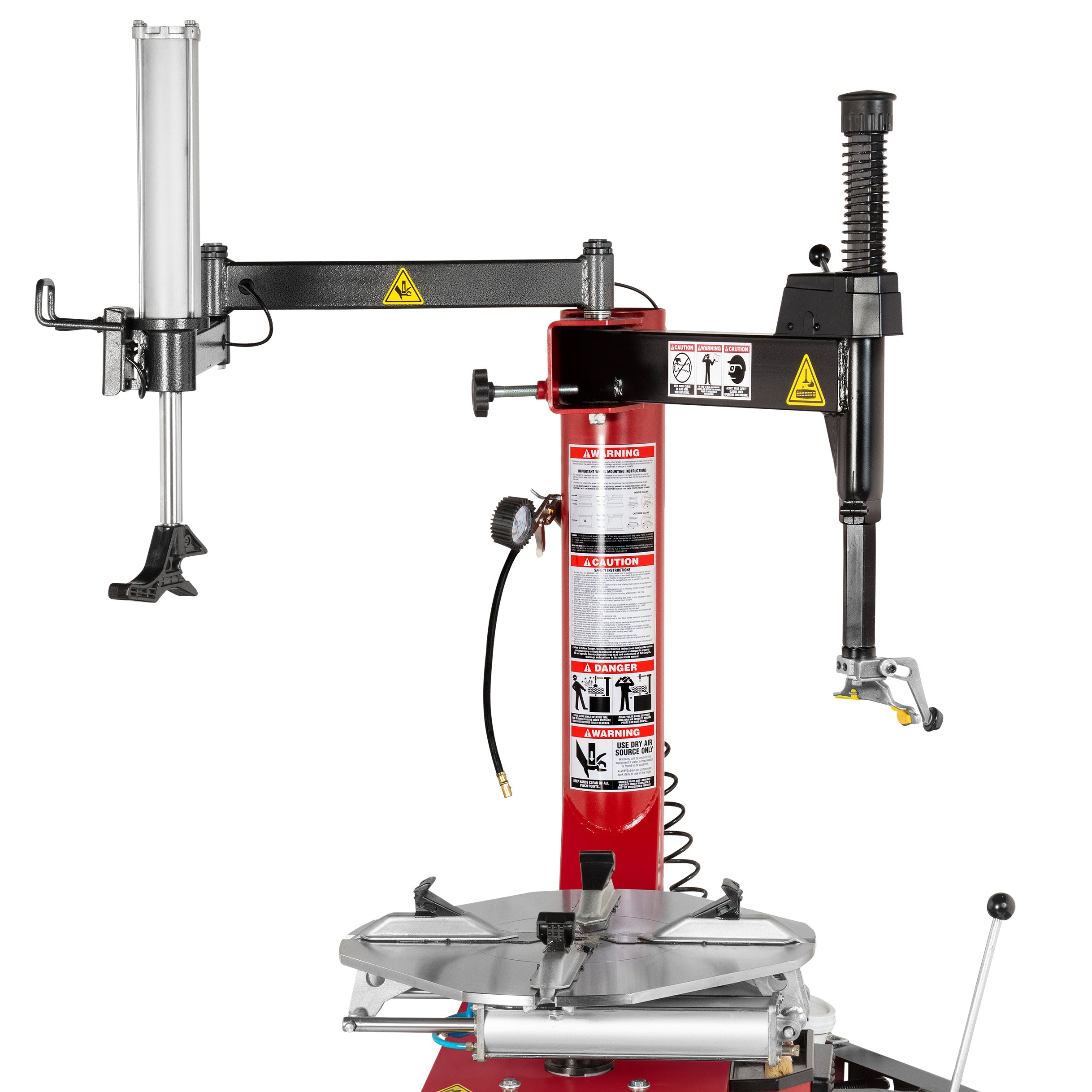 Swing-assist arm and tower on an APEX AT26A automatic tire changer for handling stiff, low-profile tires.