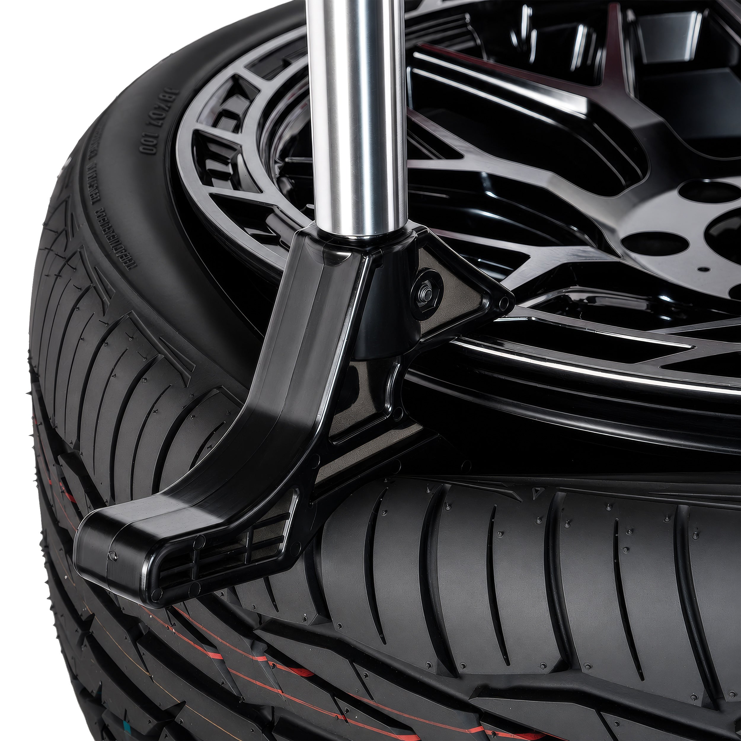 Tire-handling hook on an APEX AT26A tire changer providing additional leverage when mounting and demounting tires.