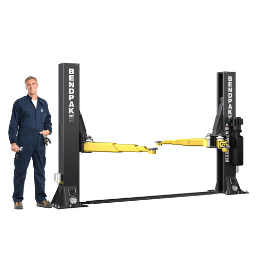 BendPak 10AP-SRT mid-rise floorplate two-post lift with a 10,000-lb. capacity and open-top design size reference operator next to lift.