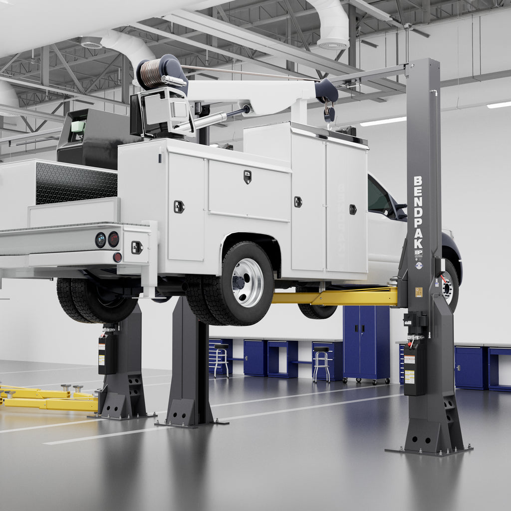 BendPak 16AP 16,000-lb. two-post lift raising a large service truck in a commercial shop.