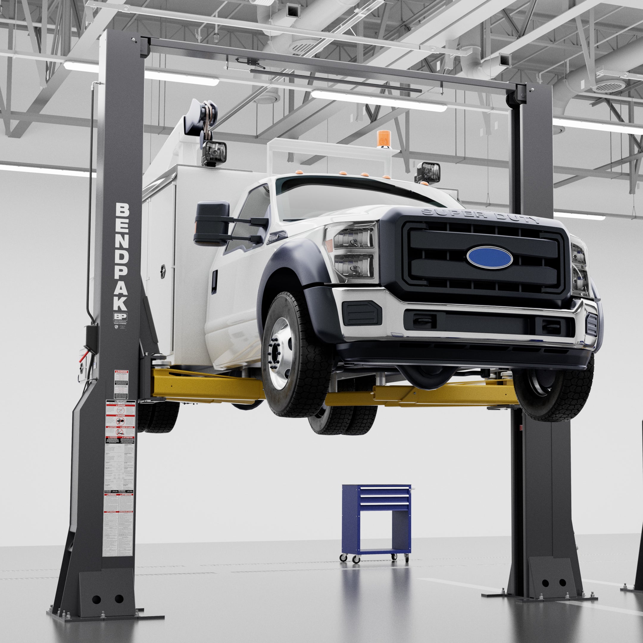 BendPak 16AP heavy-duty two-post lift raising a large service truck in a commercial shop.