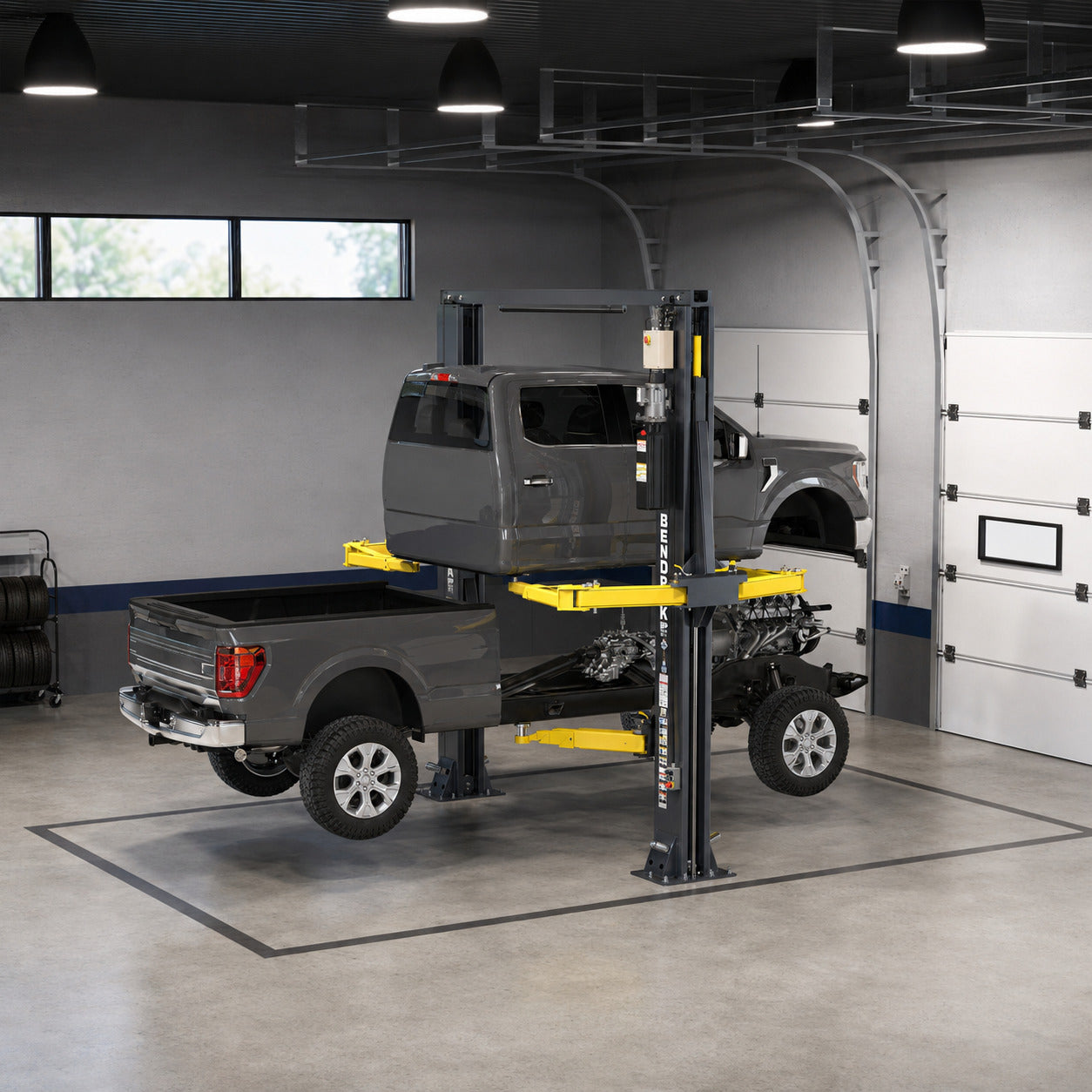 BendPak EV12DPS OctaFlex lift supporting a separated pickup cab and chassis during cab-off service in a commercial shop bay.