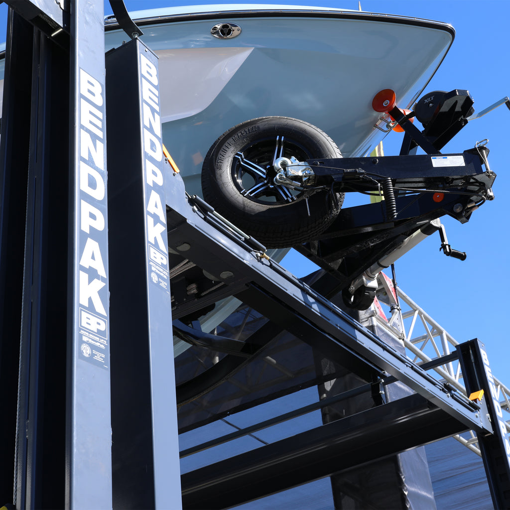 BendPak HD-7500PBX super-tall four-post lift for boat and vehicle storage.