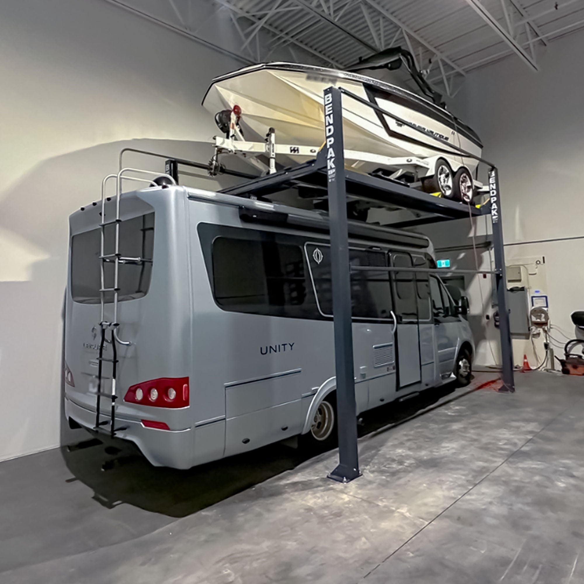 BendPak HD-7500PBX portable four-post lift for vehicle parking and maintenance access
