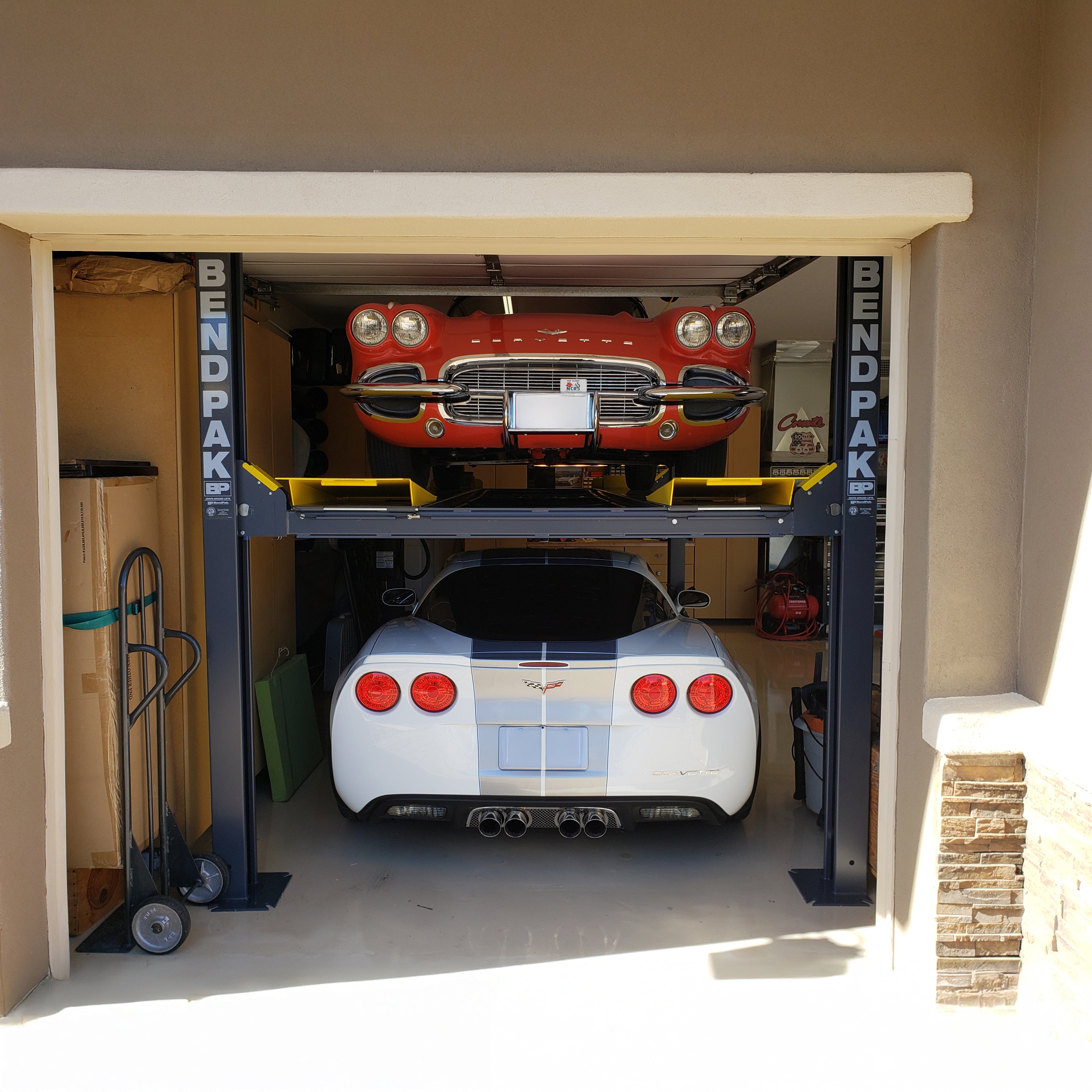 BendPak HD-9ST narrow four-post lift designed for double parking and vehicle storage.