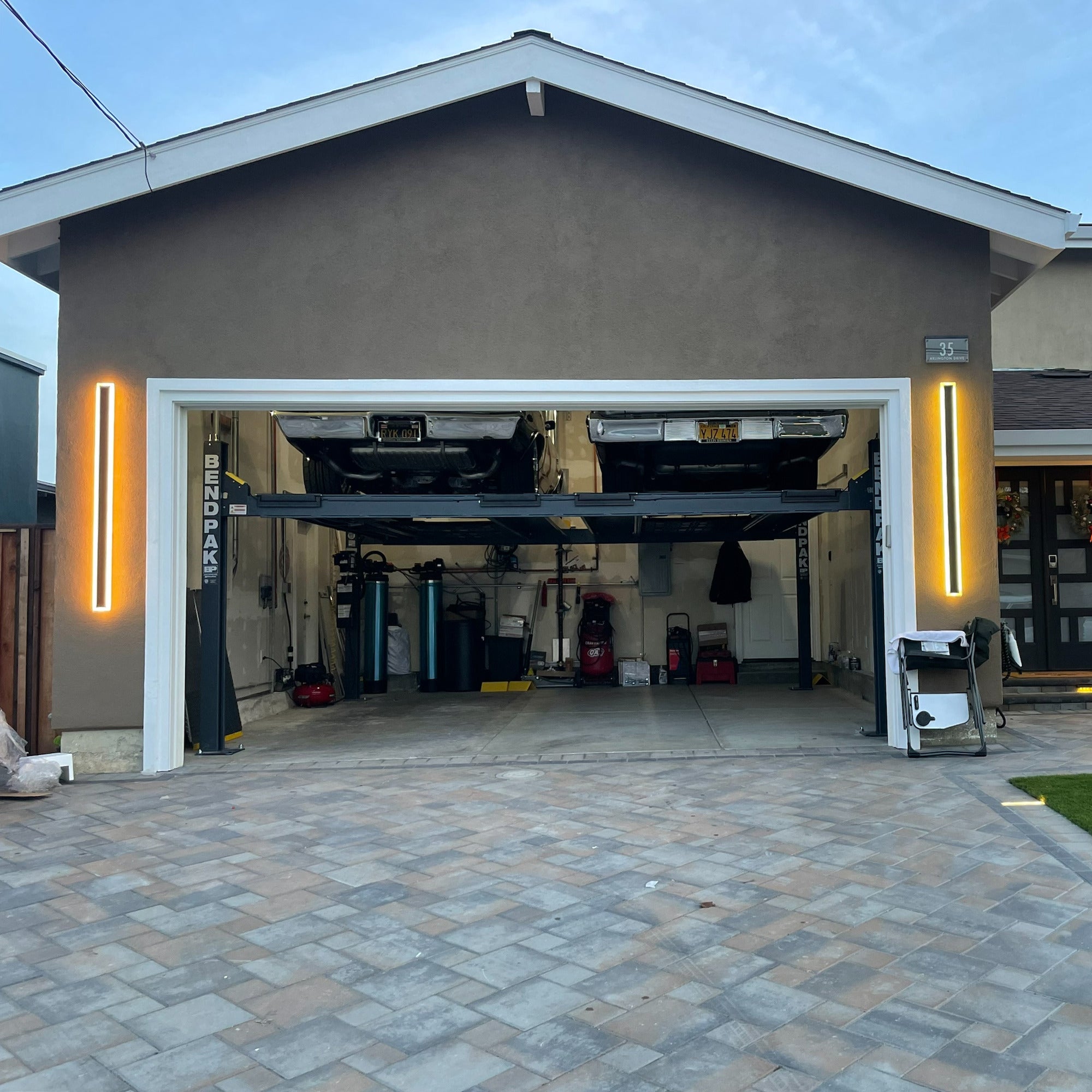 BendPak HD-9SW dual-platform super-wide lift in a home garage storage application.