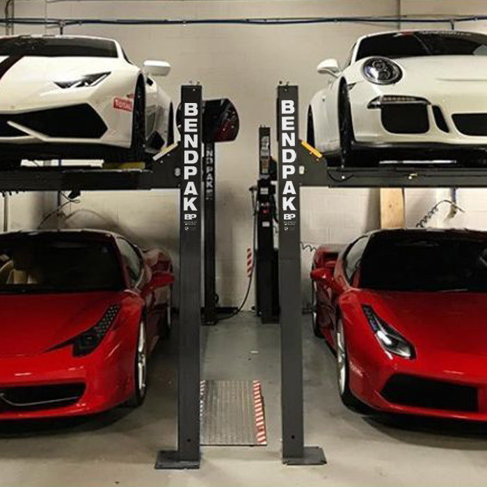 BendPak HD-9XW extra-wide four-post lift installed in a garage service space.