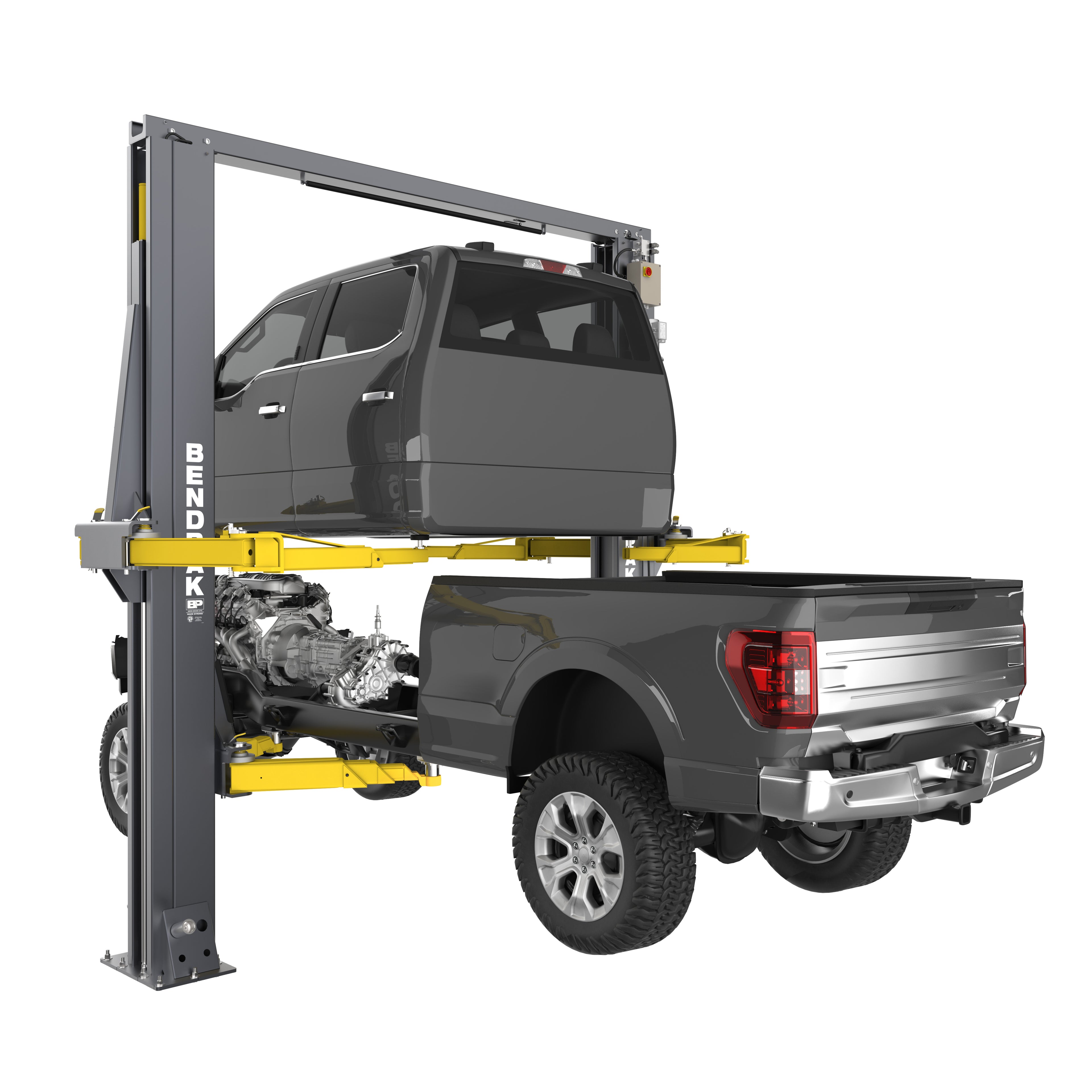 Pickup cab and chassis separated on the eight lifting arms of a 12,000-lb.-capacity BendPak OctaFlex clear-floor two-post lift.