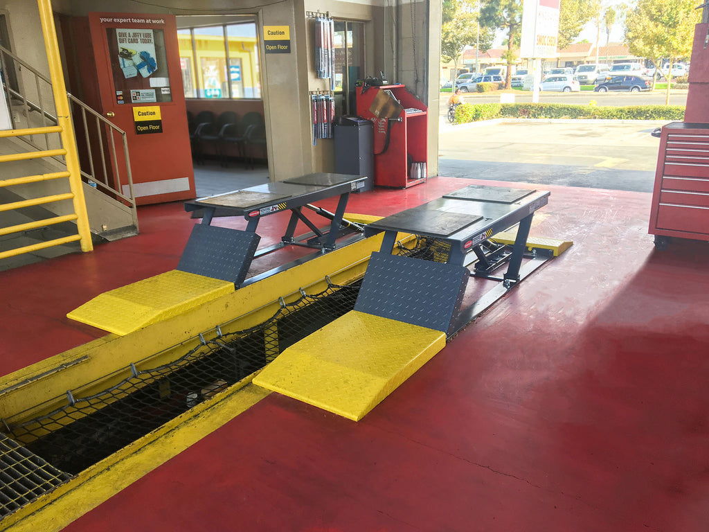 BendPak P-9000LT 9,000-lb. low-rise scissor lift installed in a garage bay.