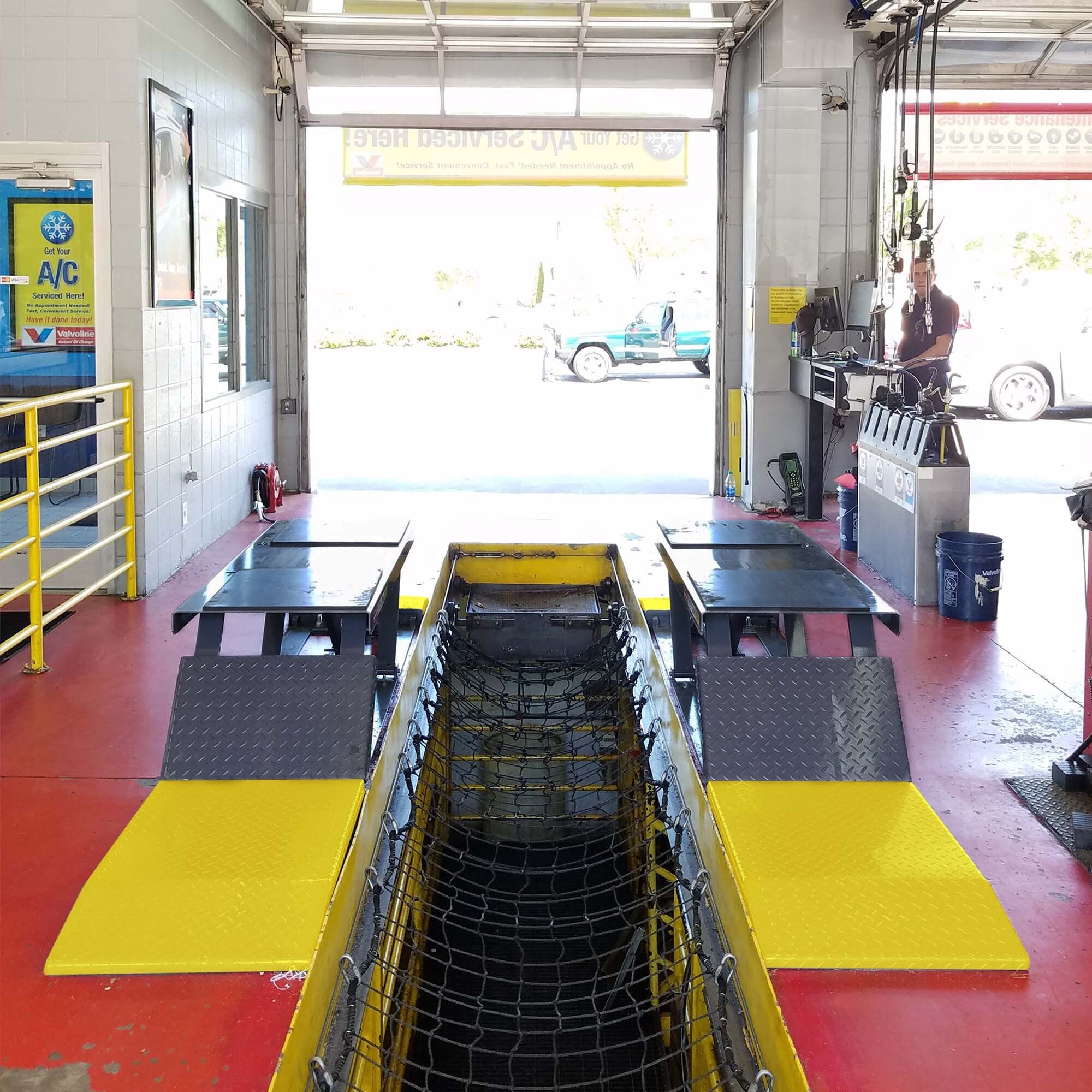 BendPak P-9000LT low-rise lift for oil change service bays