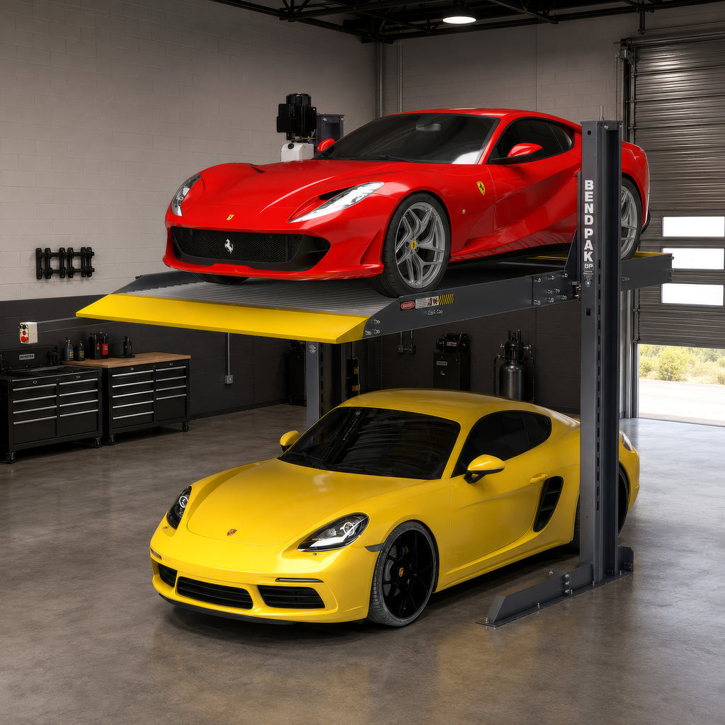 Two vehicles stored vertically on a BendPak PL-6000DC two-post parking lift in a commercial garage.