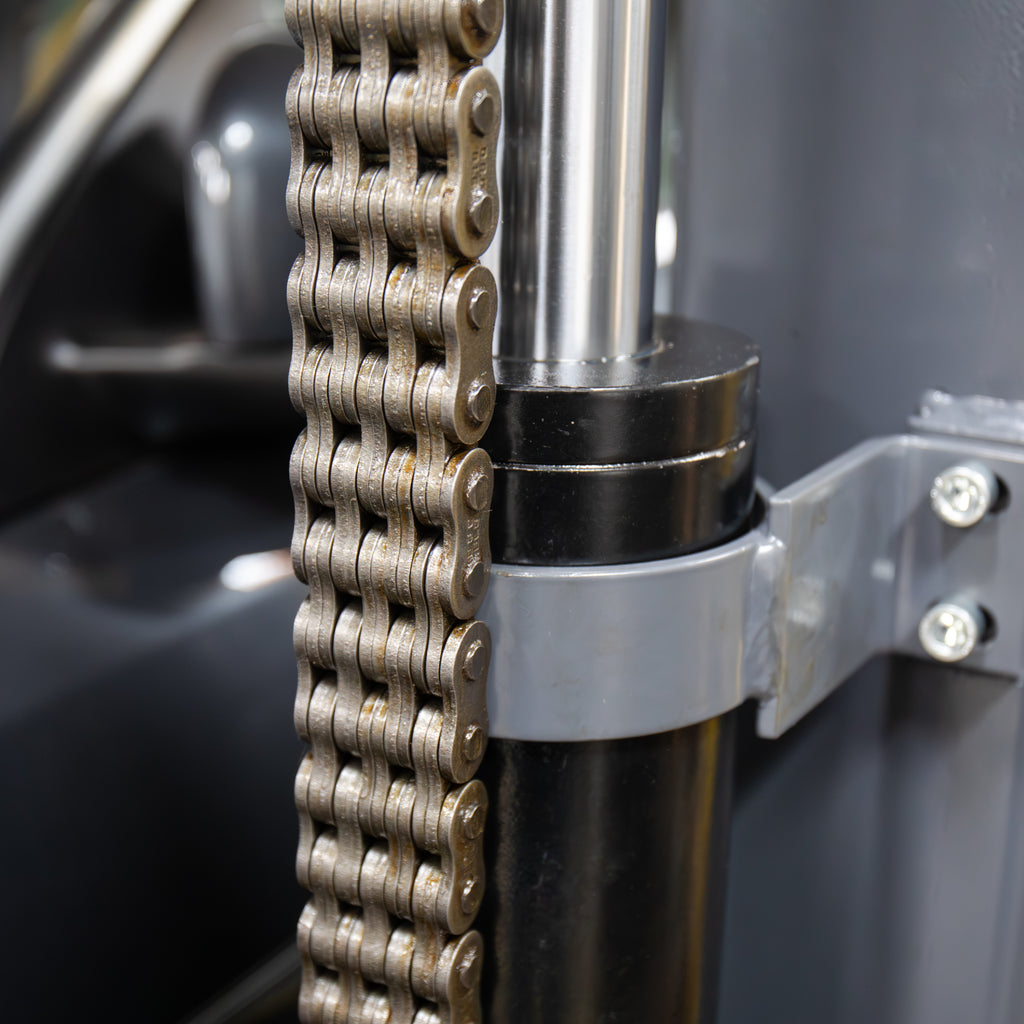 BendPak PL-6000DCX parking lift hydraulic cylinder and chain drive components.