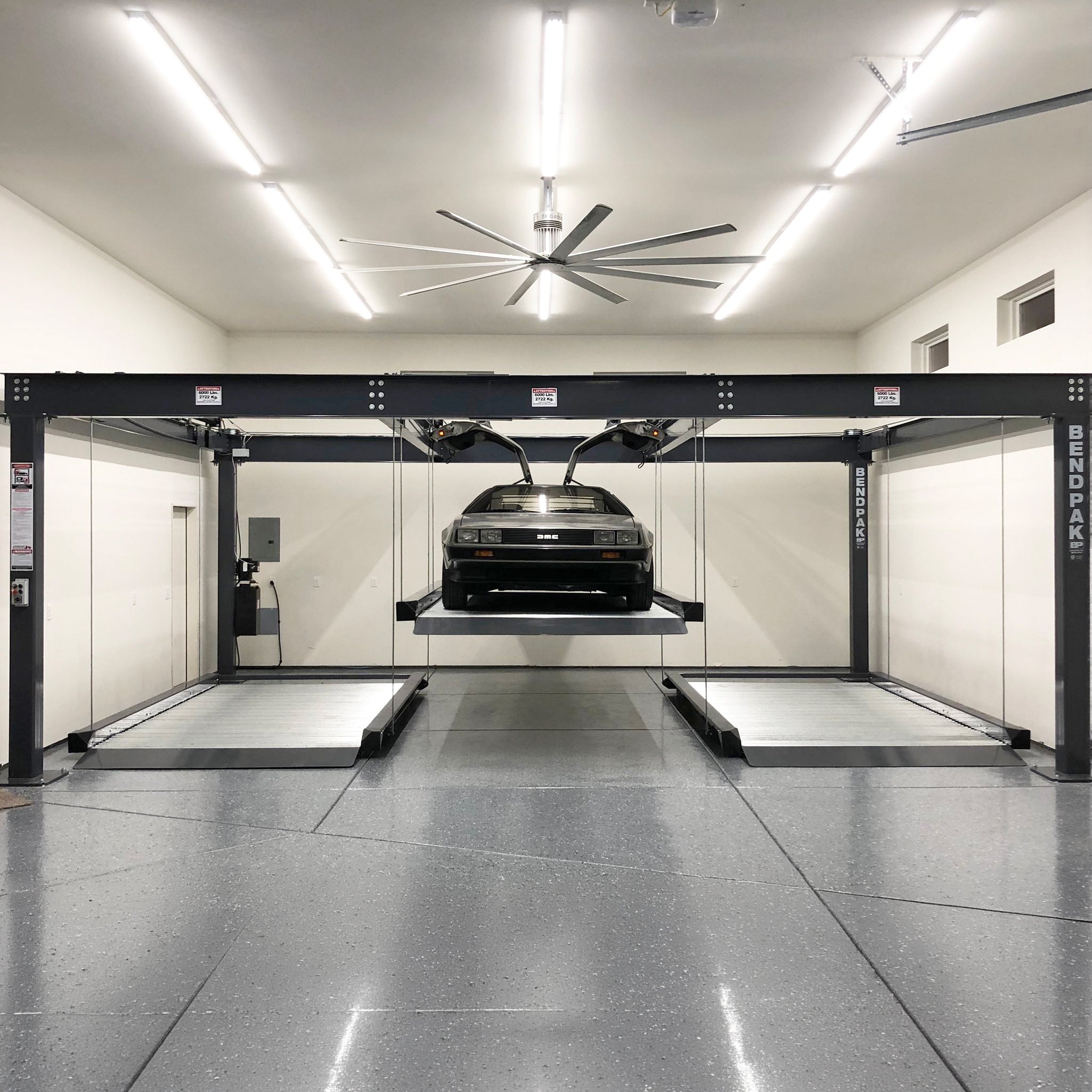 BendPak PL-6KT parking lift with triple independent platforms and 18,000-lb total capacity.