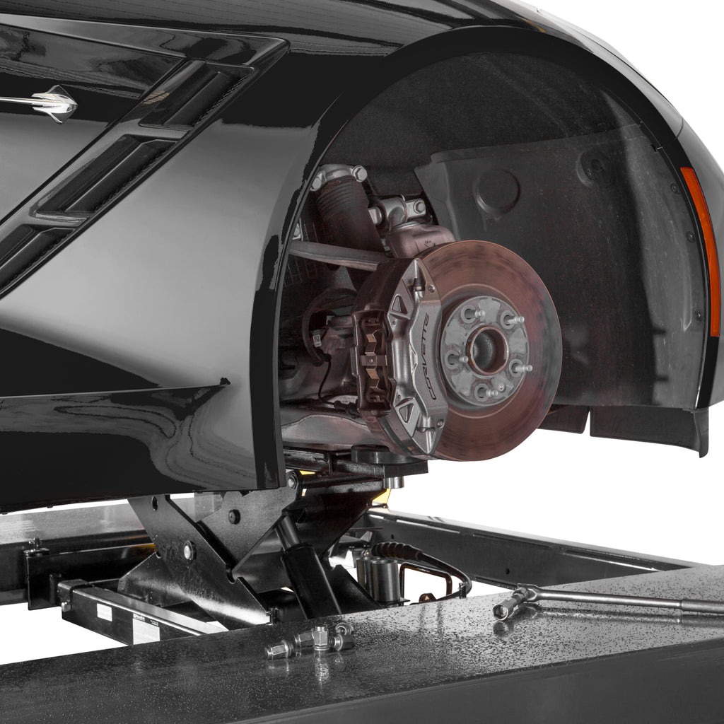 BendPak RJ45W rolling bridge jack lifting a sports car for wheel-free service access.