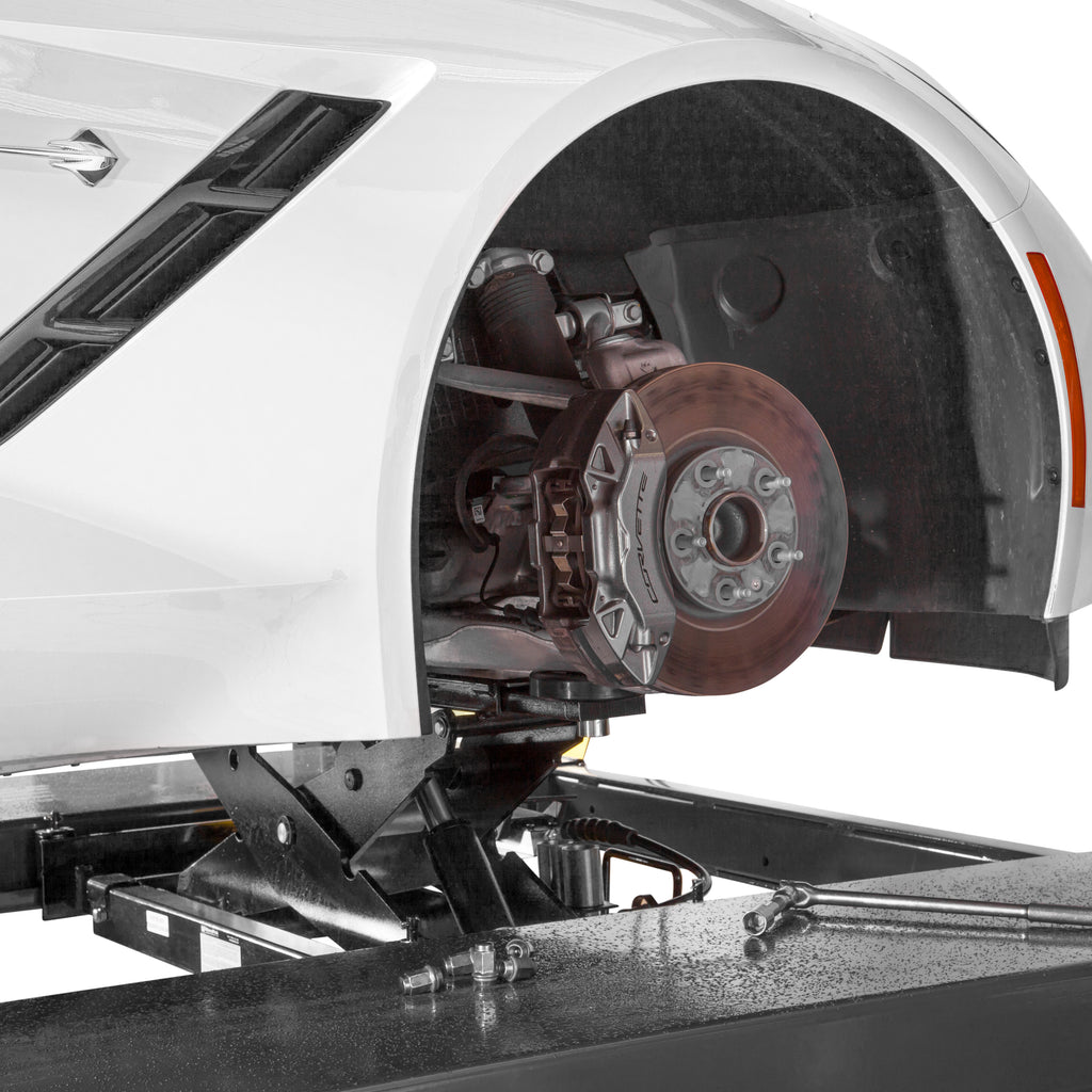 BendPak RJ6W rolling bridge jack lifting a sports car for four-post lift service.