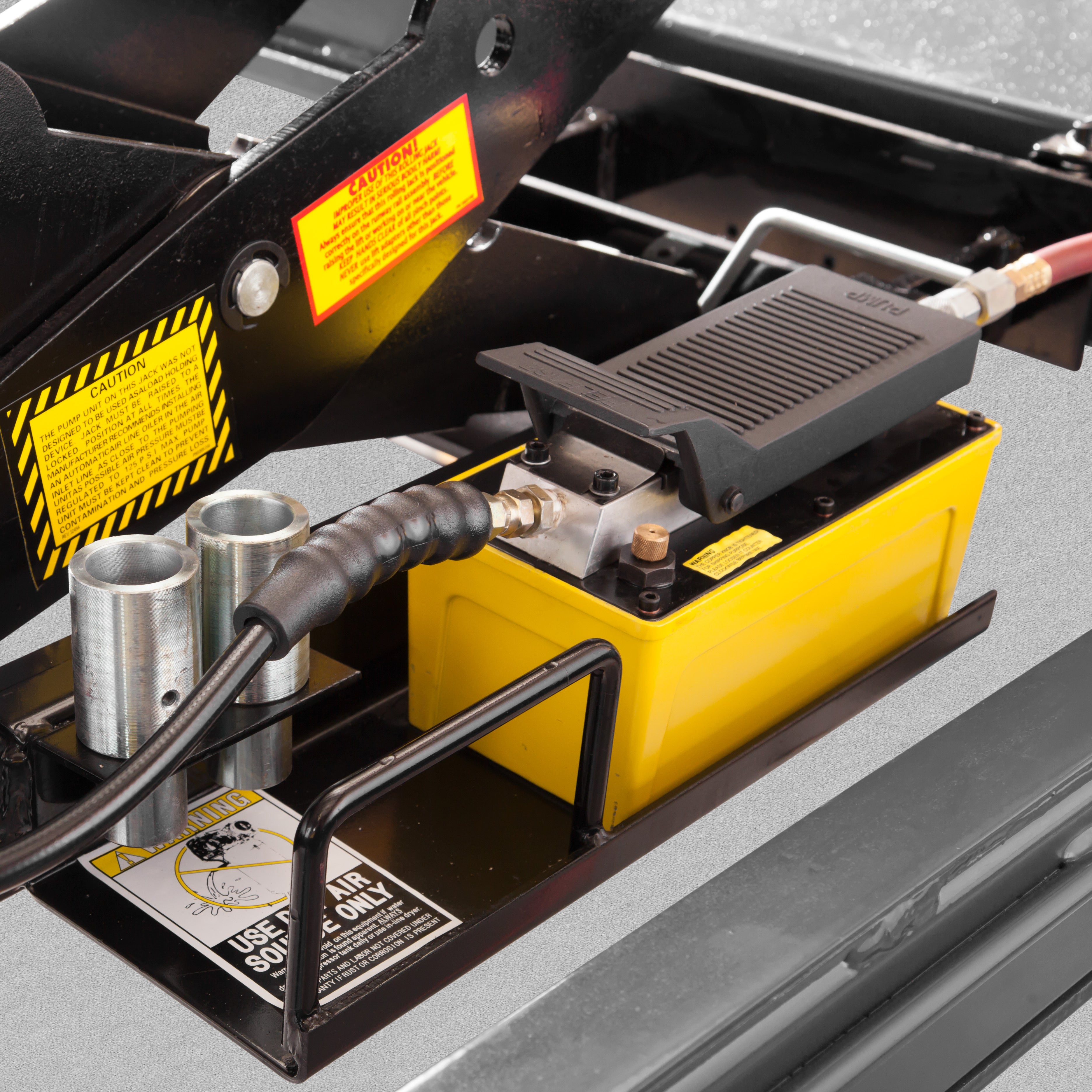 BendPak RJ9W rolling bridge jack air-hydraulic pump with medium-height adapters.