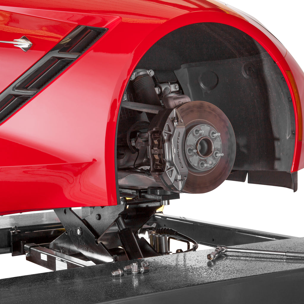 BendPak RJ9W rolling bridge jack lifting a sports car on a four-post service lift.