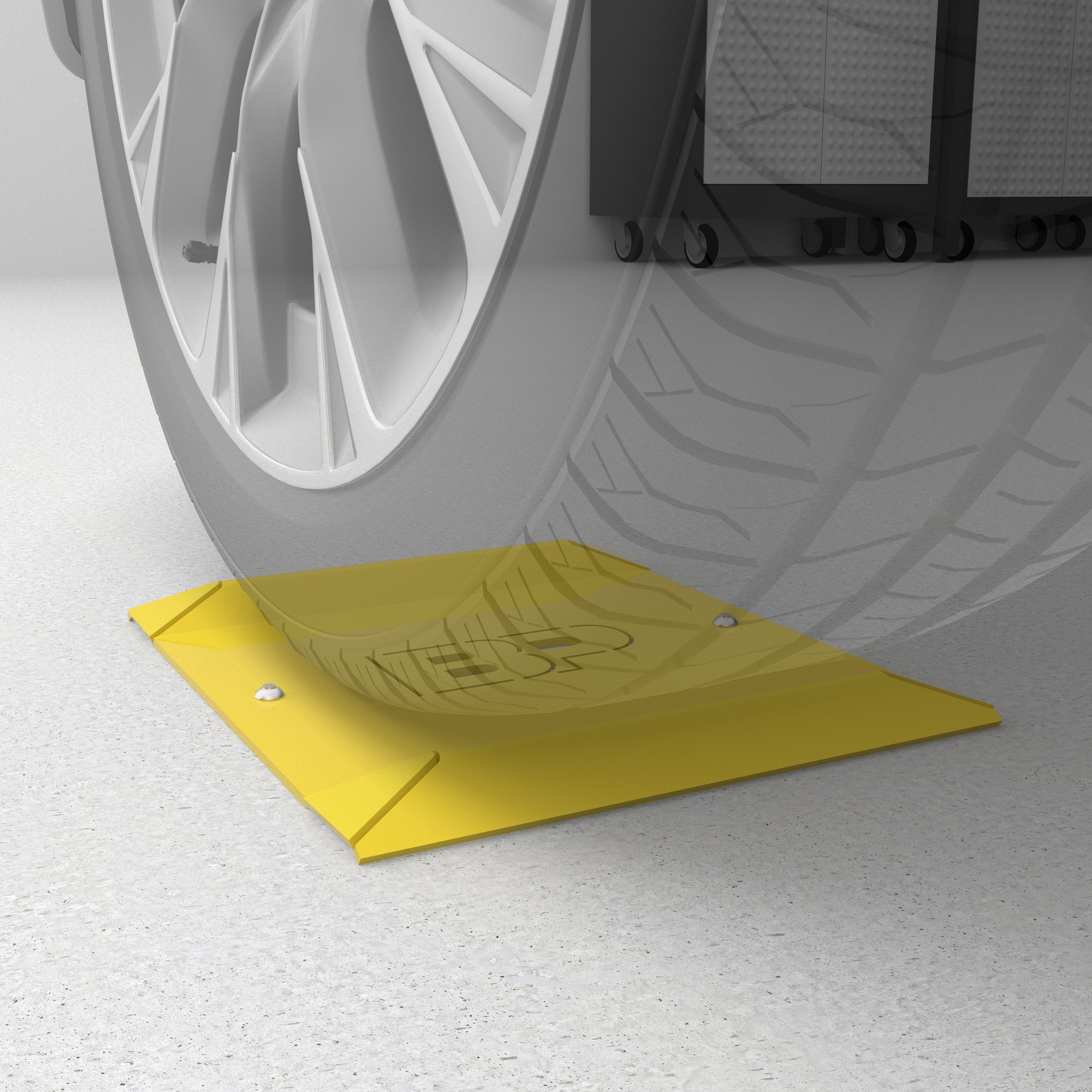 BendPak wheel spotting dish kit mounted under tire for parking alignment