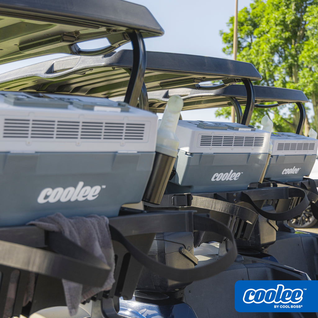 Fleet of golf carts equipped with Cool Boss COOLEE TOUR LX portable air coolers.
