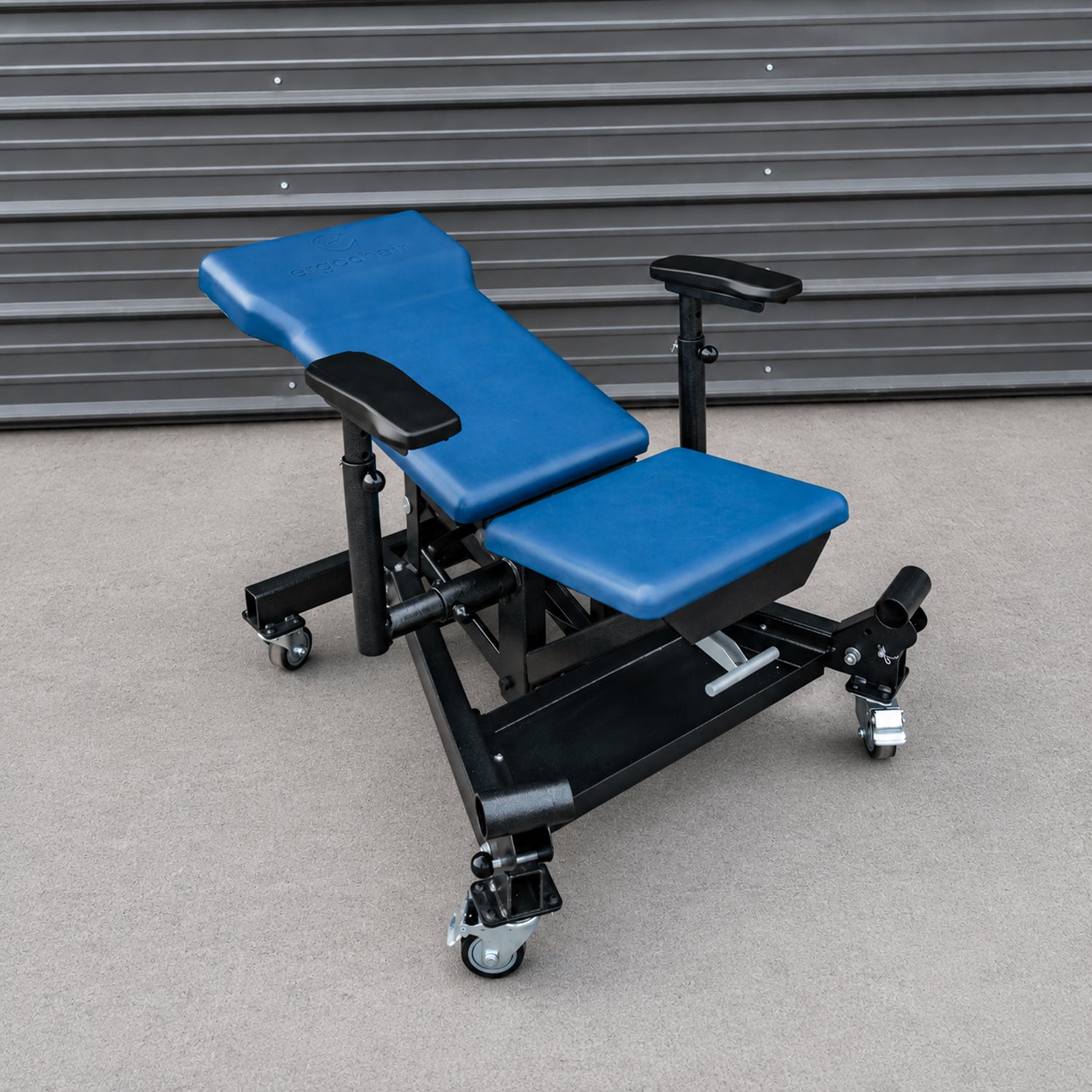 Ergochair Ergo-JET ergonomic height-adjustable work seat provides comfortable support for automotive service tasks at different working levels.