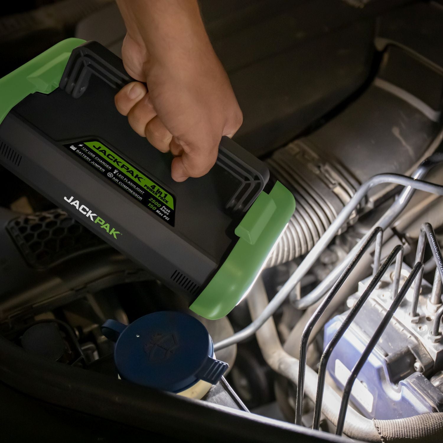 JackPak Ultra2500A LED flashlight illuminating an engine bay for under-hood service