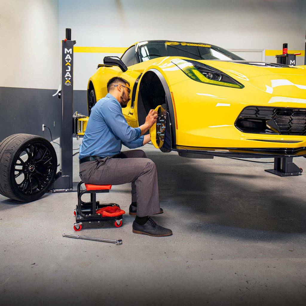 MaxJax M7K 7,000-lbs. portable two-post lift set up for vehicle maintenance
