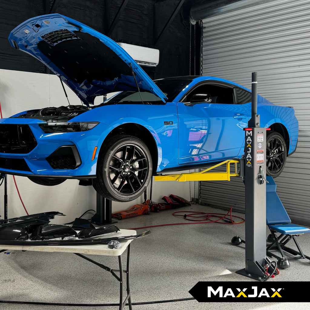 MaxJax M7K portable two-post car lift for home garage use with a 7,000-lb. capacity.