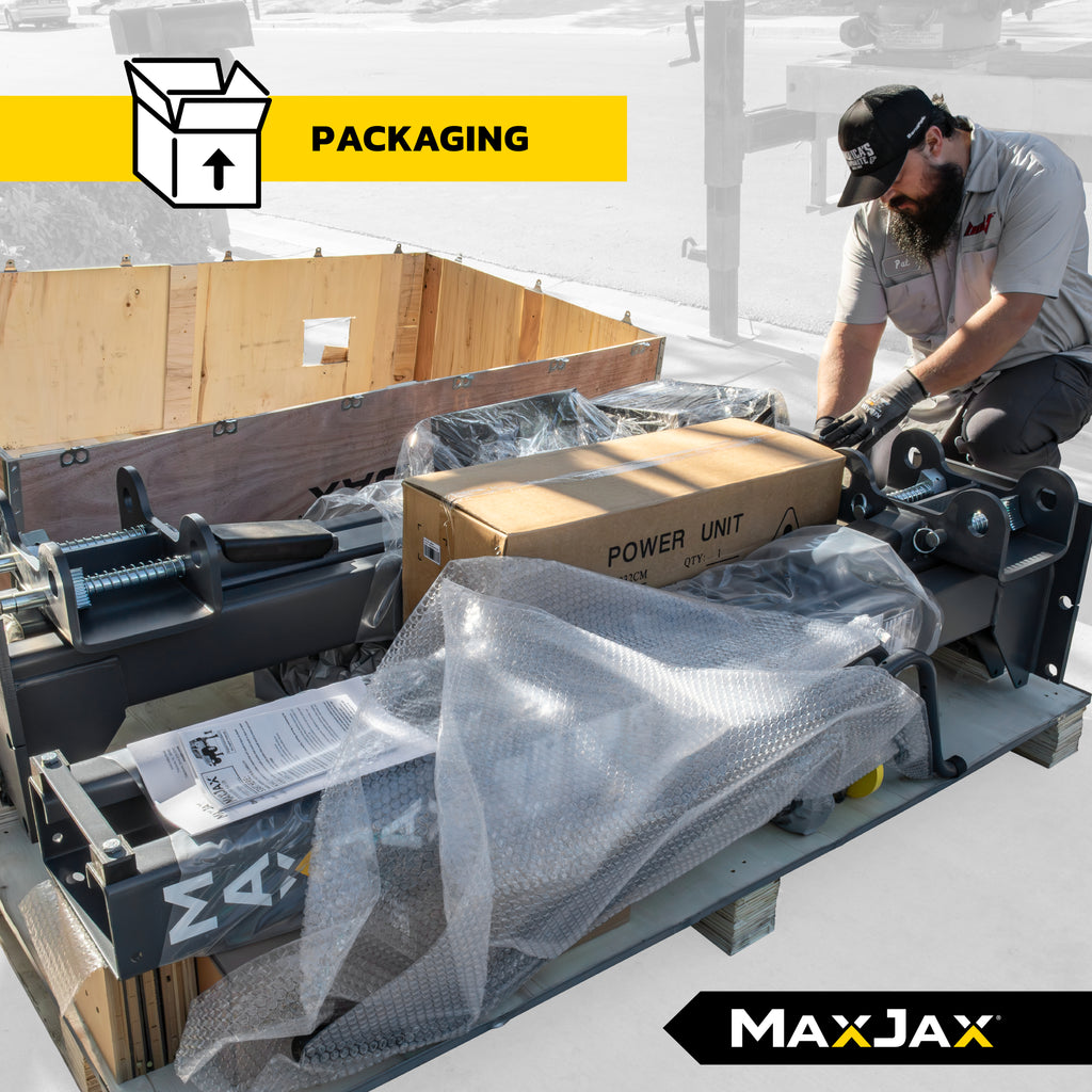 MaxJax M7K Supreme package crate showing packed portable two-post lift components.