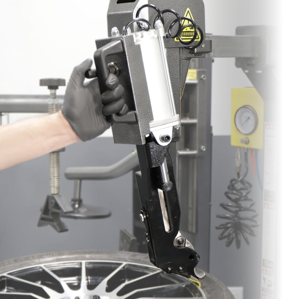 Ranger leverless auto bead lifter kit shown with operator during tire changer service