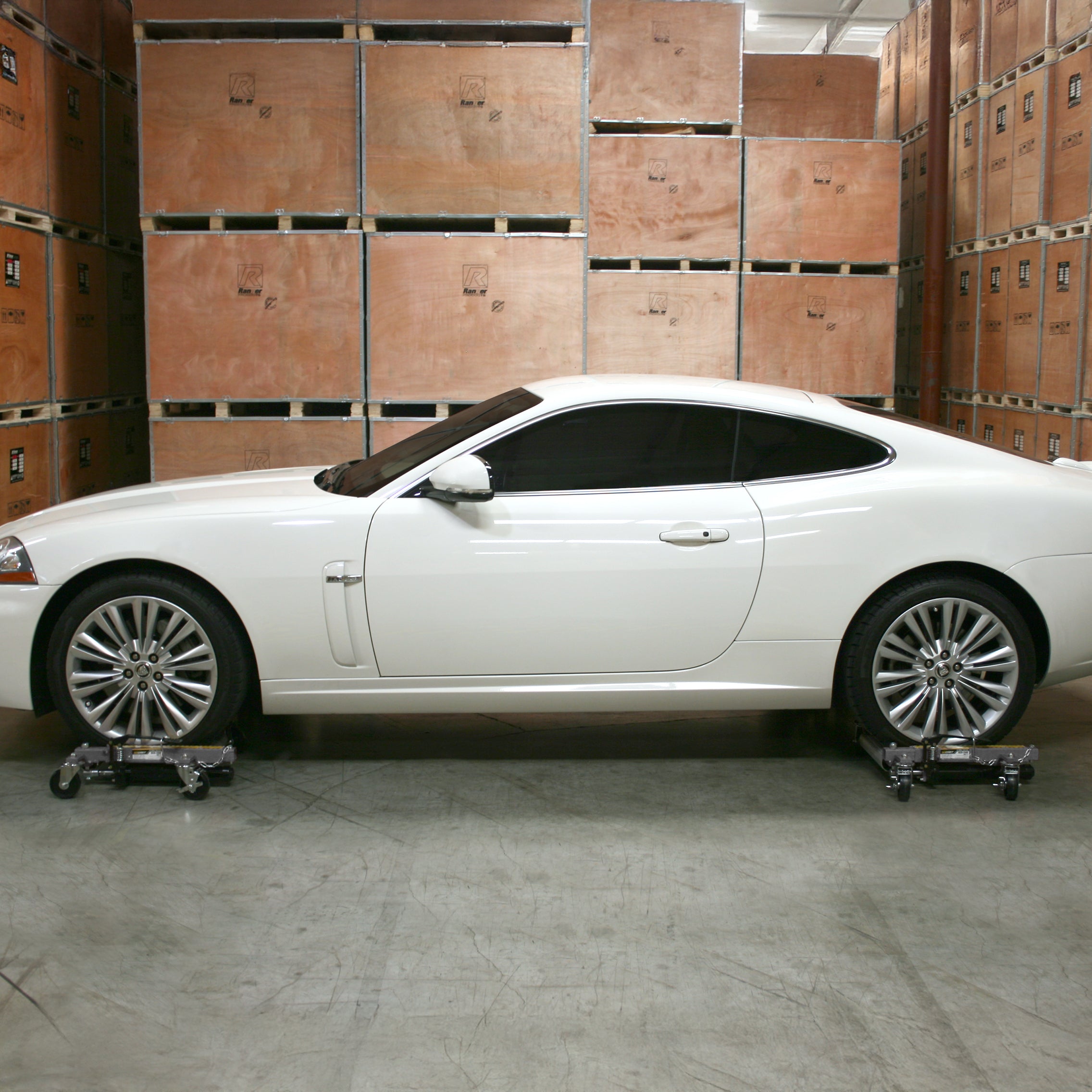 Ranger RCD-1500 car dollies moving luxury car in garage or shop