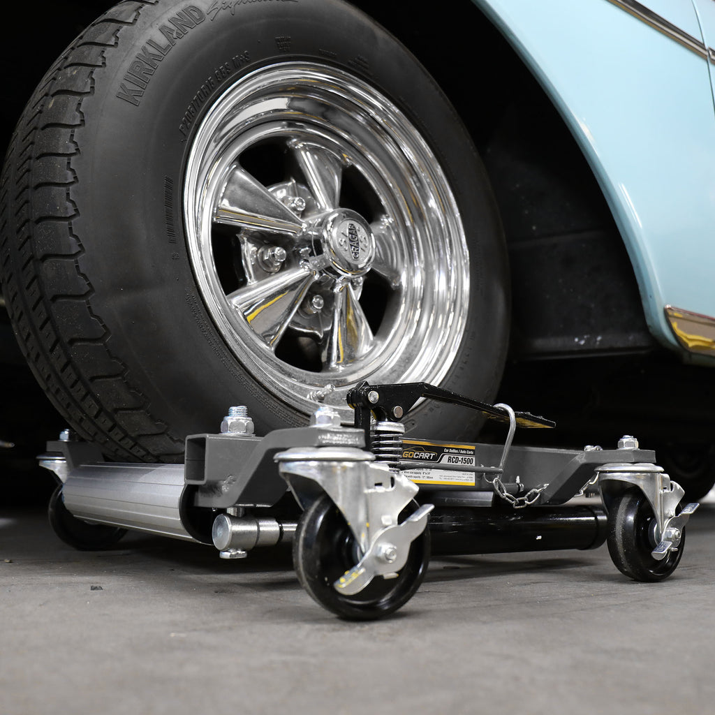 Ranger RCD-1500 car dolly supporting a vehicle tire for easy positioning in the shop