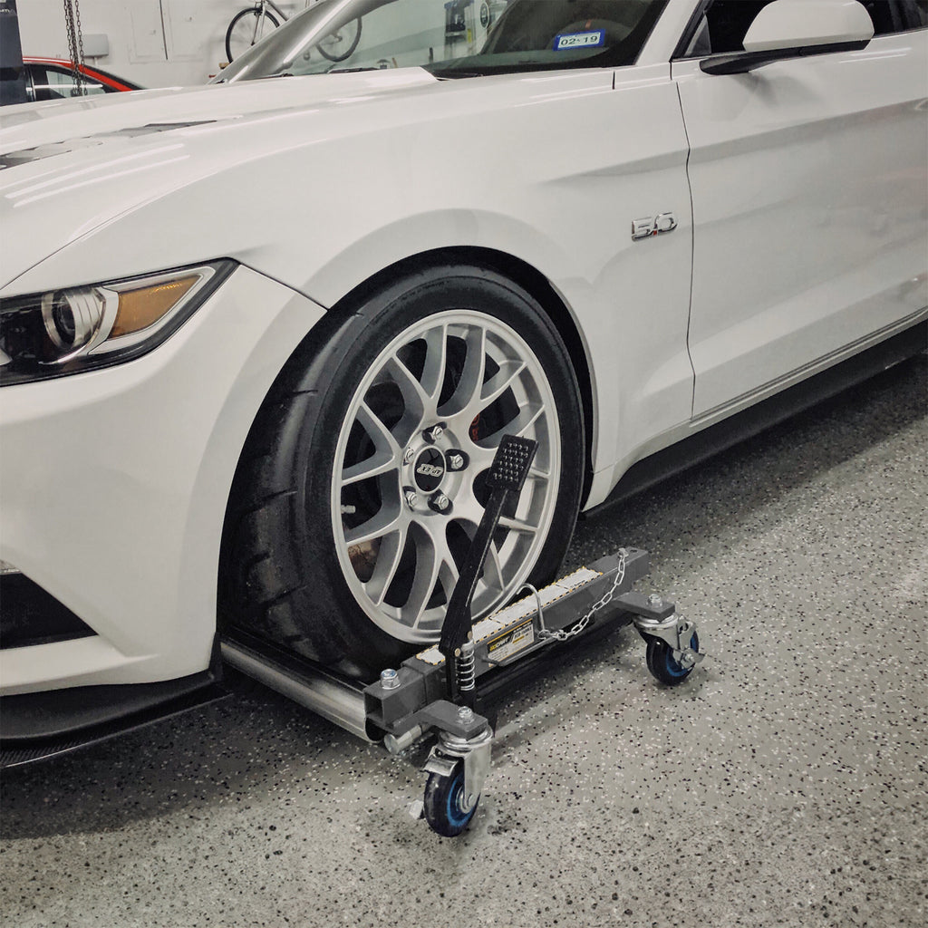 Ranger RCD-1500EX car dolly shown in use beneath a vehicle wheel