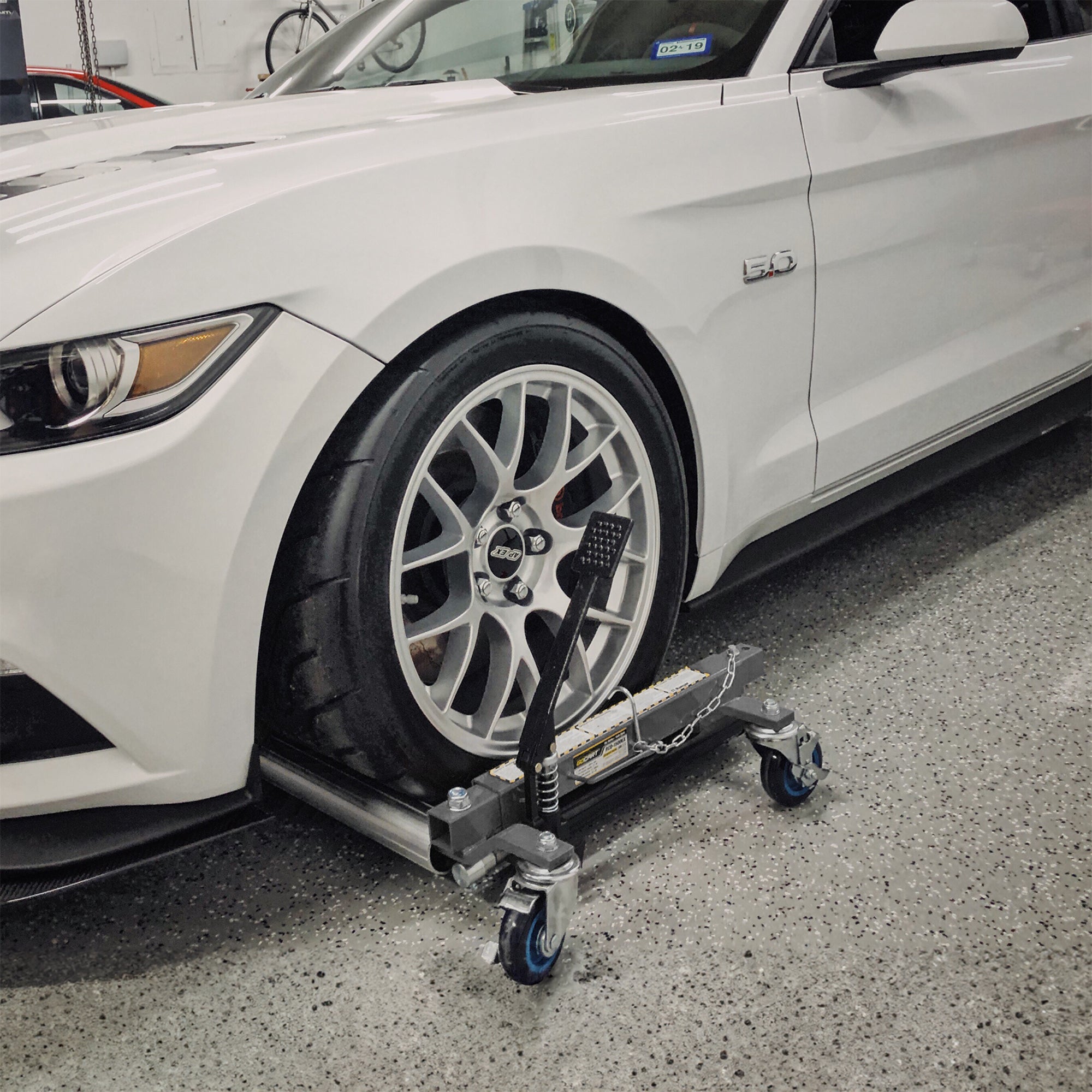 Ranger RCD-1500EX car dolly shown in use beneath a vehicle wheel