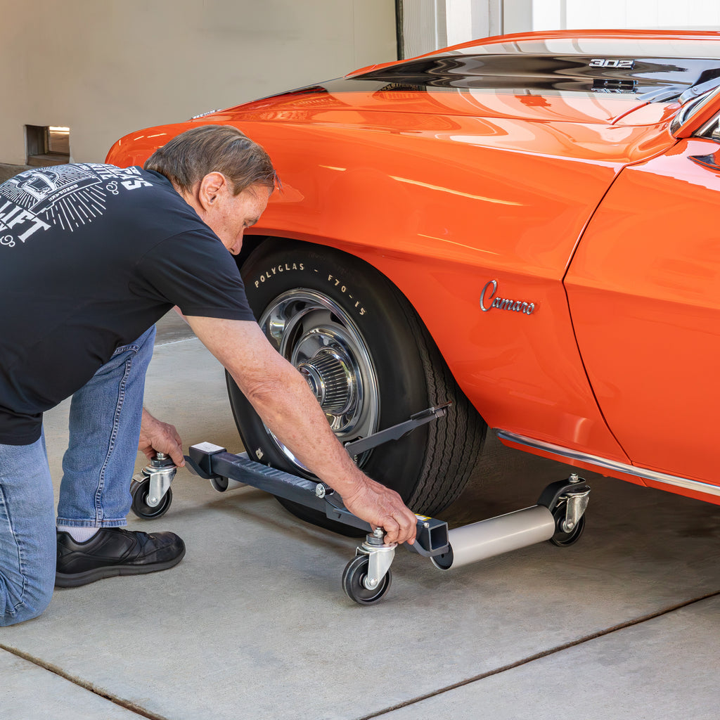 Ranger RCD-1500MP car dolly positioned by operator under muscle car tire