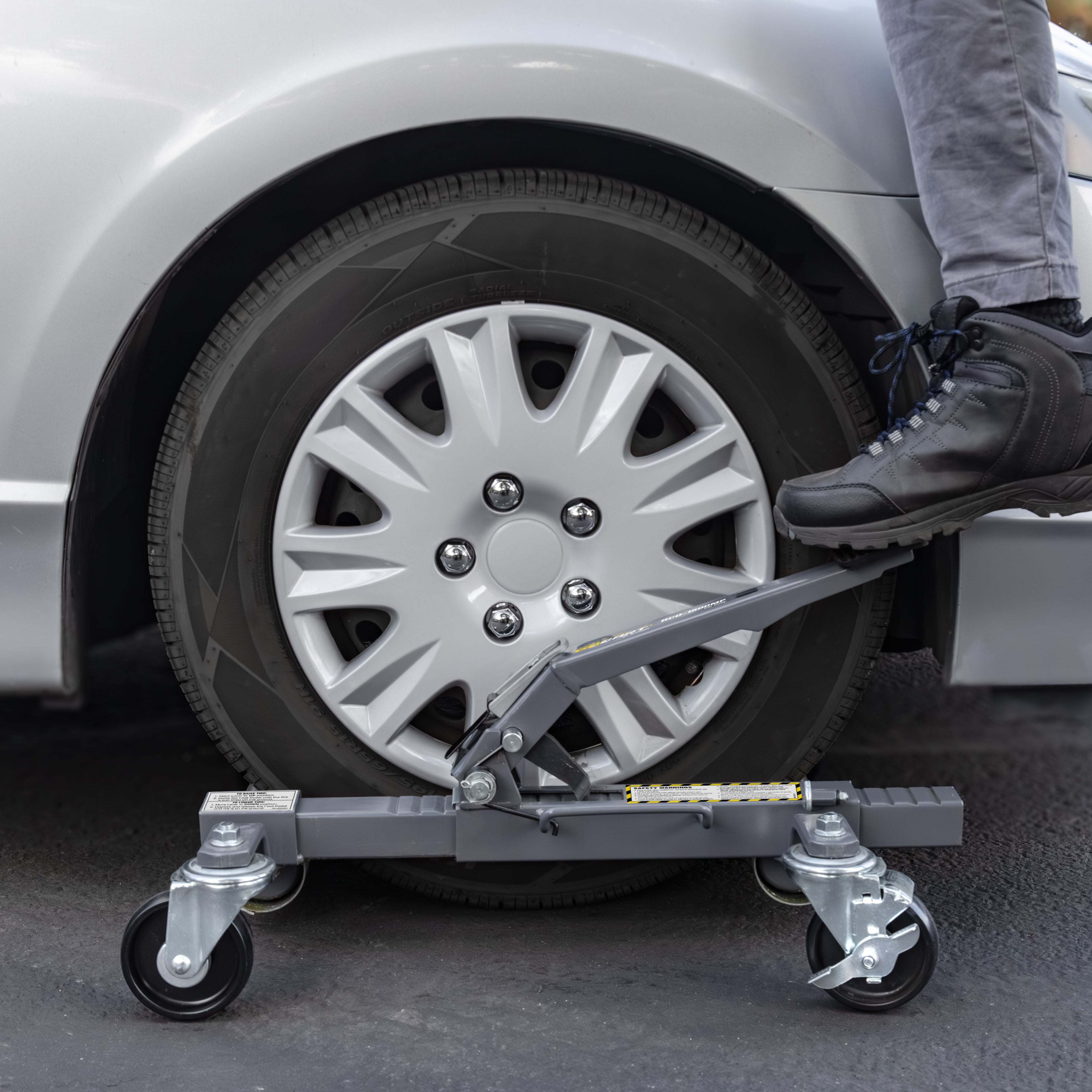 Ranger RCD-1500MP 1,500-lb car dolly supporting vehicle tire during positioning