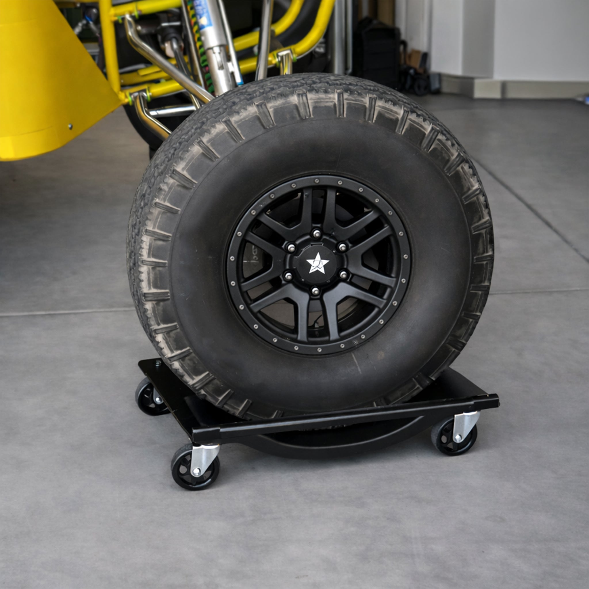 Ranger RCD-1TD wheel dolly moving off-road vehicle in garage
