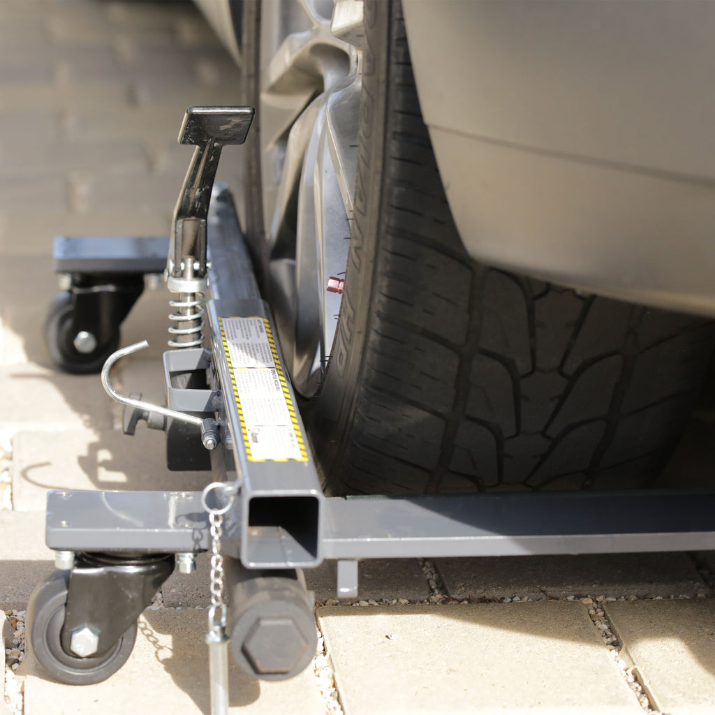 Ranger RCD-2500 vehicle dollies supporting car tire during shop positioning