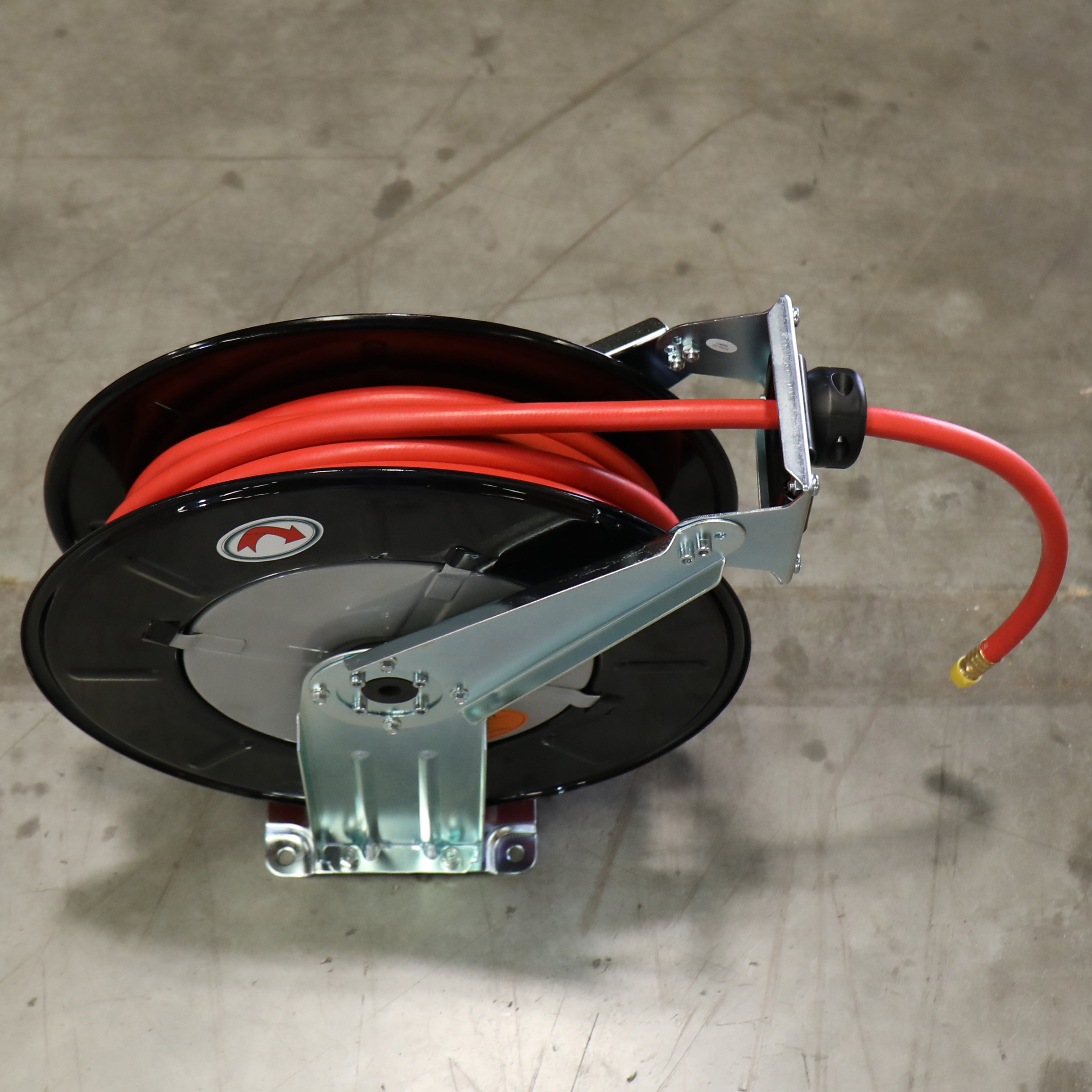 RH-50PL retractable air hose reel installed for professional garage air tool setup with a durable wall-mount design and extended compressed air hose.