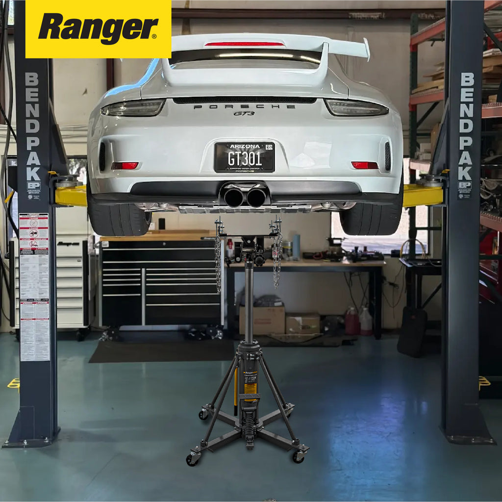 Ranger RTJ-3000 transmission jack positioned under two-post vehicle lift