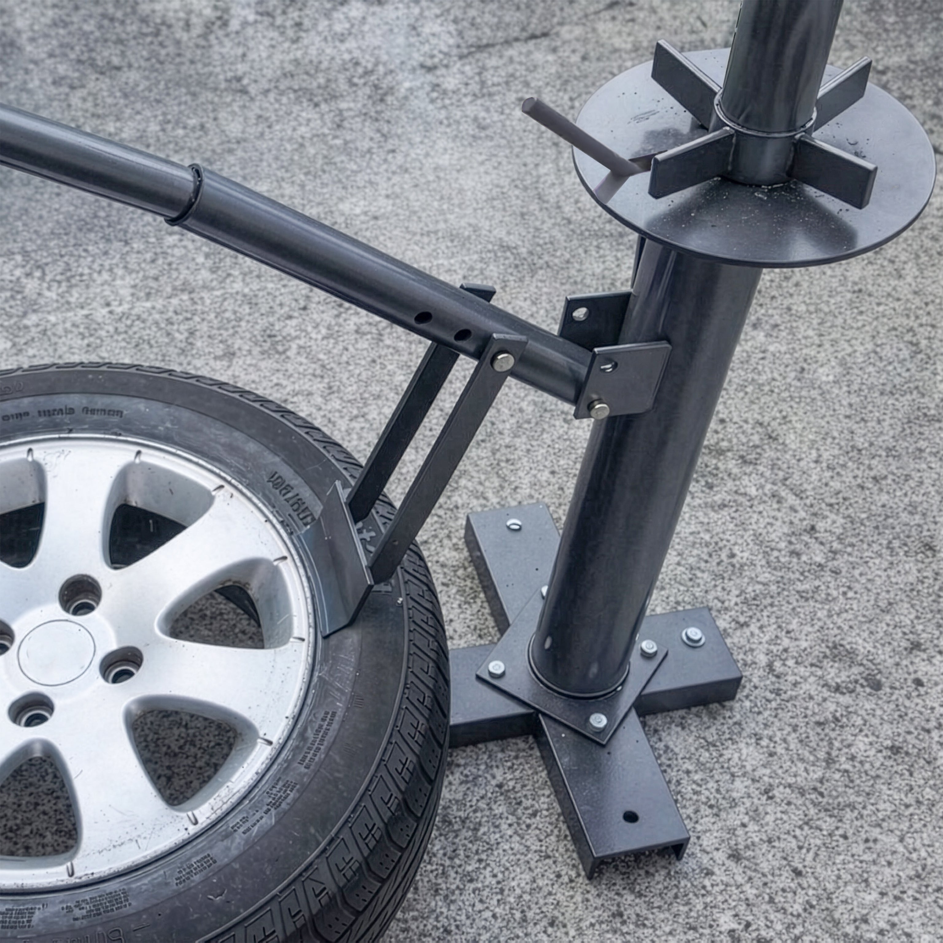 Ranger RWS-3TC manual tire changer shown breaking tire bead during wheel service